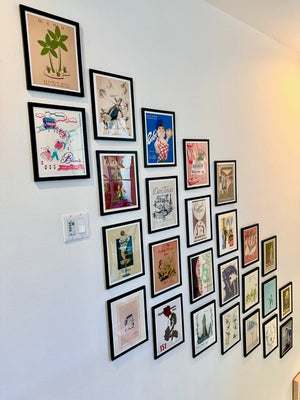 Collection of framedVintage Menu Art on a wall 