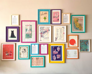 Wall with colorful framed Vintage Menu Art